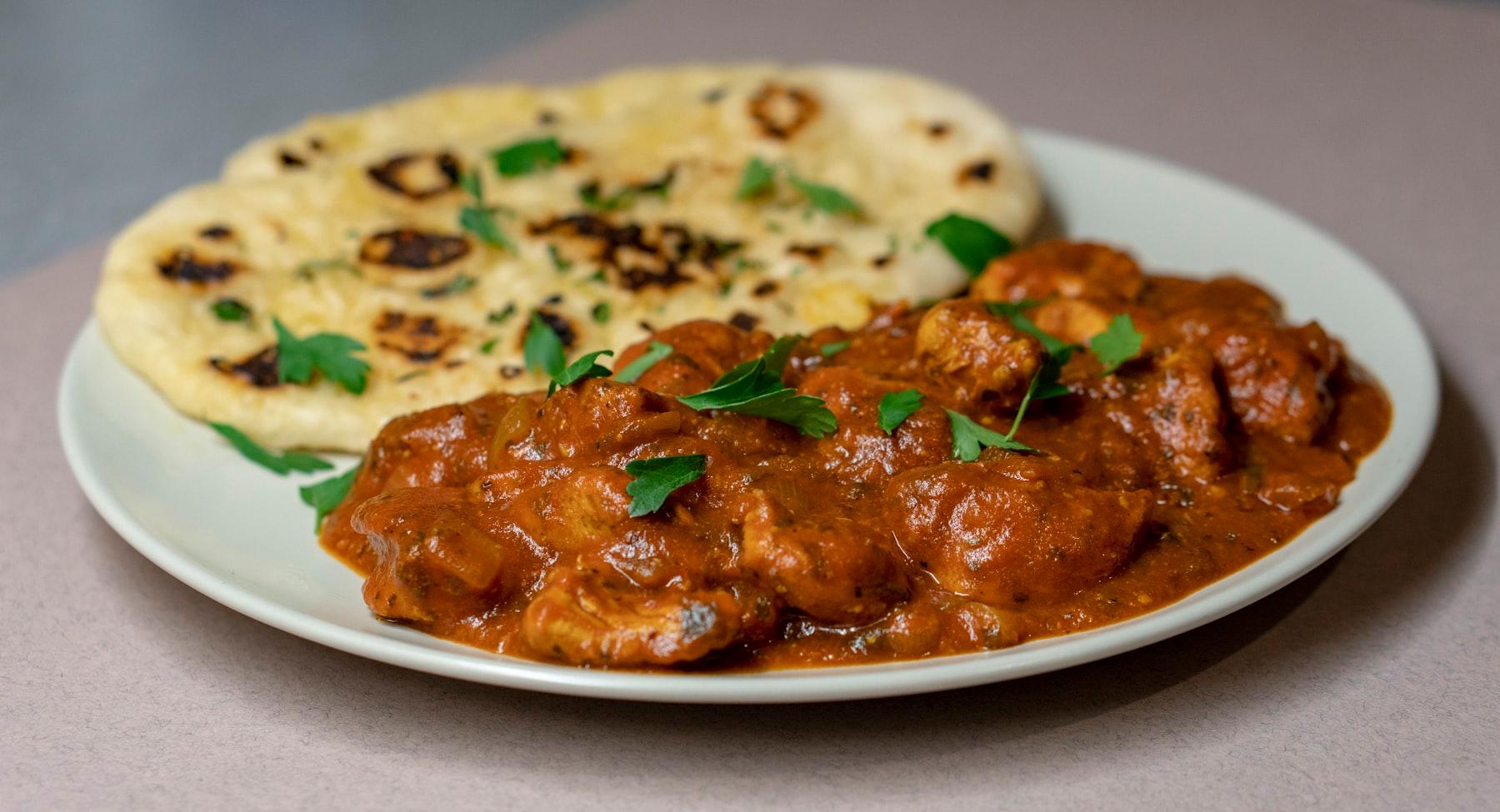 A rich curry served with fresh naan